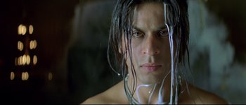Movie still from “Asoka” (2001), directed by Santosh Sivan – A person with wet hair; Close Up shot, Low angle