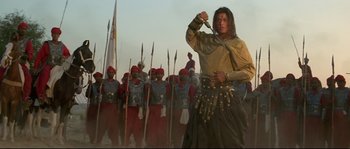 Movie still from “Asoka” (2001), directed by Santosh Sivan – A group of men in red and yellow uniforms; Wide shot, Low angle