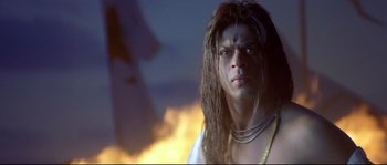 Movie still from “Asoka” (2001), directed by Santosh Sivan – A person with long dreadlocks; Close Up shot, Low angle