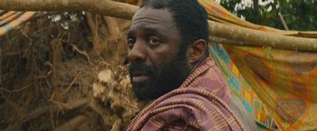 Movie still from “Beasts of No Nation” (2015), directed by Cary Joji Fukunaga – A person with a beard; Close Up shot, High angle