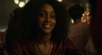 A person with long curly hair