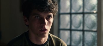 Movie still from “Black Mirror: Bandersnatch” (2018), directed by David Slade – A person looking at the camera; Close Up shot, Over the shoulder angle