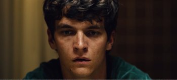 Movie still from “Black Mirror: Bandersnatch” (2018), directed by David Slade – A young man's face; Close Up shot, Low angle