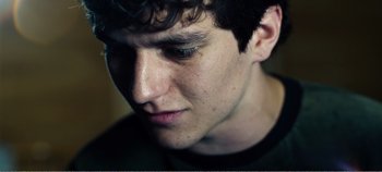 Movie still from “Black Mirror: Bandersnatch” (2018), directed by David Slade – A young man's face; Extreme Close Up shot, Low angle