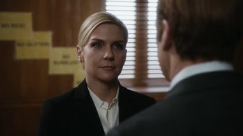 Movie still from “Better Call Saul” (2015), created by Vince Gilligan – A woman wearing a suit and tie talking to a man in a suit and tie; Close Up shot, Over the shoulder angle