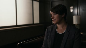 Movie still from “Better Call Saul” (2015), created by Vince Gilligan – A woman sitting in a chair in front of a window; Close Up shot, Over the shoulder angle