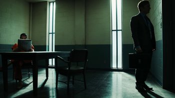 Movie still from “Better Call Saul” (2015), created by Vince Gilligan – A room filled with chairs and a table in it; Wide shot, Low angle