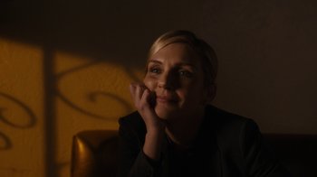 Movie still from “Better Call Saul” (2015), created by Vince Gilligan – A woman sitting in a chair with her hand under her chin; Close Up shot, Low angle