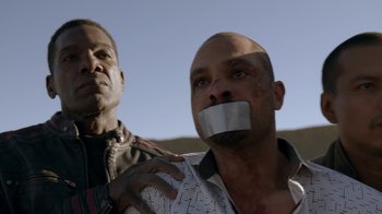 Movie still from “Better Call Saul” (2015), created by Vince Gilligan – Two men with their mouths taped shut; Close Up shot, Low angle