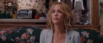 Movie still from “Bridesmaids” (2011), directed by Paul Feig – A person sitting on a couch; Close Up shot, Over the shoulder angle