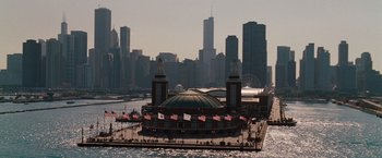 Movie still from “Bridesmaids” (2011), directed by Paul Feig – A pier with a building on top of it; Extreme Wide shot, High angle