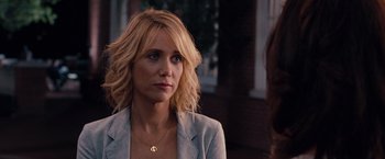 Movie still from “Bridesmaids” (2011), directed by Paul Feig – A woman with blonde curly hair wearing a jacket; Close Up shot, Over the shoulder angle