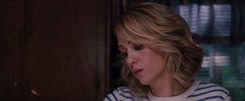 Movie still from “Bridesmaids” (2011), directed by Paul Feig – A person with blonde hair; Close Up shot, Over the shoulder angle