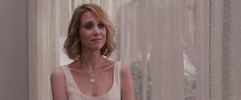 Movie still from “Bridesmaids” (2011), directed by Paul Feig – A person wearing a white shirt; Close Up shot, Over the shoulder angle