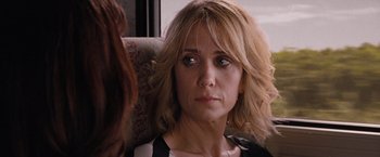 Movie still from “Bridesmaids” (2011), directed by Paul Feig – A person sitting in a chair; Close Up shot, Over the shoulder angle