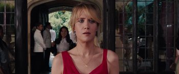 Movie still from “Bridesmaids” (2011), directed by Paul Feig – A person wearing a red dress; Close Up shot, Over the shoulder angle