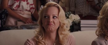 Movie still from “Bridesmaids” (2011), directed by Paul Feig – A woman with a frowning look on her face; Close Up shot, Low angle