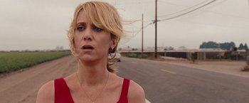 Movie still from “Bridesmaids” (2011), directed by Paul Feig – A woman standing on the side of a road; Close Up shot, Over the shoulder angle