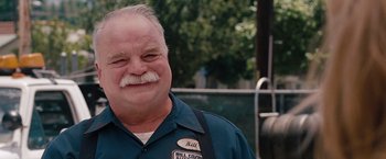 Movie still from “Bridesmaids” (2011), directed by Paul Feig – An older man with a mustache and a beard; Close Up shot, Low angle