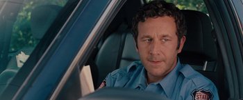 Movie still from “Bridesmaids” (2011), directed by Paul Feig – A person sitting in a car; Close Up shot, Over the shoulder angle