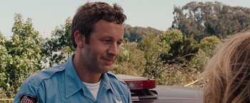 Movie still from “Bridesmaids” (2011), directed by Paul Feig – A person sitting in a car; Close Up shot, Over the shoulder angle