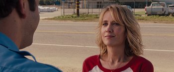Movie still from “Bridesmaids” (2011), directed by Paul Feig – A person wearing a red and white shirt; Close Up shot, Over the shoulder angle