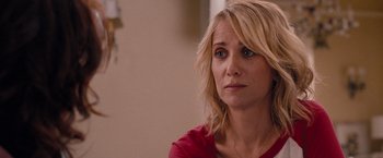 Movie still from “Bridesmaids” (2011), directed by Paul Feig – A person sitting in front of a wall; Close Up shot, Over the shoulder angle