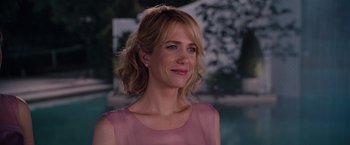 Movie still from “Bridesmaids” (2011), directed by Paul Feig – A person wearing a pink dress; Close Up shot, Over the shoulder angle