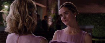Movie still from “Bridesmaids” (2011), directed by Paul Feig – A woman in a purple dress talking to another woman in a purple dress; Close Up shot, Over the shoulder angle