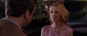 Movie still from “Bridesmaids” (2011), directed by Paul Feig – A woman in a pink dress talking to a man in a purple shirt; Close Up shot, Over the shoulder angle