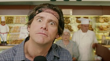 Movie still from “Bruce Almighty” (2003), directed by Tom Shadyac – A man with a spider on his head looking surprised; Close Up shot, Over the shoulder angle
