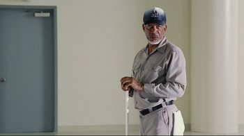 Movie still from “Bruce Almighty” (2003), directed by Tom Shadyac – An older man holding a cane in a room; Medium shot, Low angle