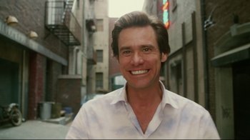 Movie still from “Bruce Almighty” (2003), directed by Tom Shadyac – A person wearing a white shirt; Medium shot, Low angle