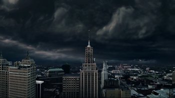 Movie still from “Bruce Almighty” (2003), directed by Tom Shadyac – A view of a city with a dark sky above it; Extreme Wide shot, Low angle