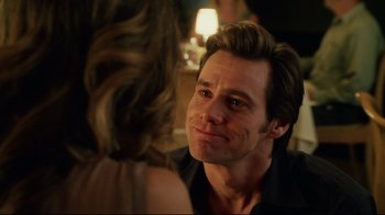 Movie still from “Bruce Almighty” (2003), directed by Tom Shadyac – A person sitting in front of another person; Close Up shot, Over the shoulder angle