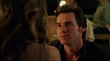 Movie still from “Bruce Almighty” (2003), directed by Tom Shadyac – A person sitting in front of another person; Close Up shot, Over the shoulder angle