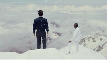 Movie still from “Bruce Almighty” (2003), directed by Tom Shadyac – Two men standing on top of a mountain looking at the sky; Extreme Wide shot, High angle