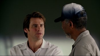 Movie still from “Bruce Almighty” (2003), directed by Tom Shadyac – A man and a man talking to each other; Close Up shot, Over the shoulder angle