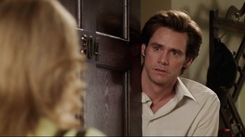 Movie still from “Bruce Almighty” (2003), directed by Tom Shadyac – A person looking at a door; Close Up shot, Over the shoulder angle