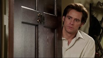 Movie still from “Bruce Almighty” (2003), directed by Tom Shadyac – A man standing in front of an open door; Close Up shot, Over the shoulder angle