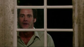 Movie still from “Bruce Almighty” (2003), directed by Tom Shadyac – A person looking through a window; Medium shot, Over the shoulder angle