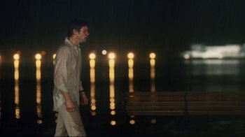 Movie still from “Bruce Almighty” (2003), directed by Tom Shadyac – A man walking by the water at night; Medium shot, Over the shoulder angle