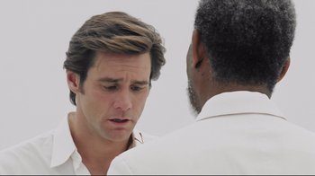 Movie still from “Bruce Almighty” (2003), directed by Tom Shadyac – A man in white shirt talking to another man in white shirt; Close Up shot, Over the shoulder angle