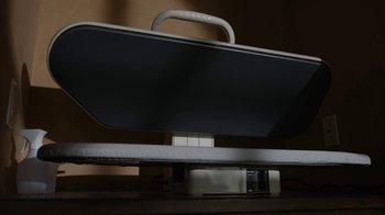 Movie still from “Better Call Saul” (2015), created by Vince Gilligan – A computer monitor sitting on top of a wooden desk; Extreme Close Up shot, Overhead angle
