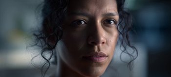 Movie still from “Chambers” (2019), created by Leah Rachel – A woman's face with curly black hair; Extreme Close Up shot, Low angle