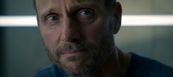 Movie still from “Chambers” (2019), created by Leah Rachel – A person with a beard; Extreme Close Up shot, Over the shoulder angle