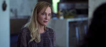 Movie still from “Chambers” (2019), created by Leah Rachel – A woman with long blonde hair looking at the camera; Close Up shot, Over the shoulder angle