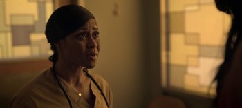 Movie still from “Chambers” (2019), created by Leah Rachel – A woman in a room looking up at the ceiling; Close Up shot, Over the shoulder angle