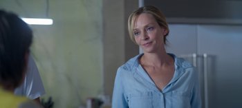 Movie still from “Chambers” (2019), created by Leah Rachel – A person wearing a blue shirt; Close Up shot, Over the shoulder angle