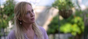Movie still from “Chambers” (2019), created by Leah Rachel – A woman with long blonde hair and blue eyes looking off into the distance; Close Up shot, Over the shoulder angle